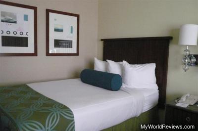 One of the two beds in the bedroom