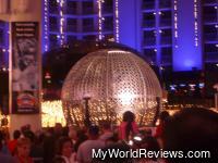 Three crazy guys riding motorbikes in a metal sphere