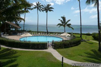 Pool, hot tub, and a view of the ocean