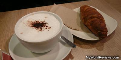 Filled croissant and cappuccino