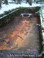 Iron in the water turns the ground orange