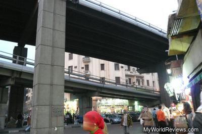 Take this road from Attaba Square to get to the bazaar (follow the raised road)