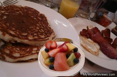 Walnut Banana Blueberry Pancakes with eggs and bacon (and tea, juice, fruit)