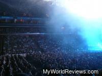 Snow (small pieces of paper) falls onto the crowd below